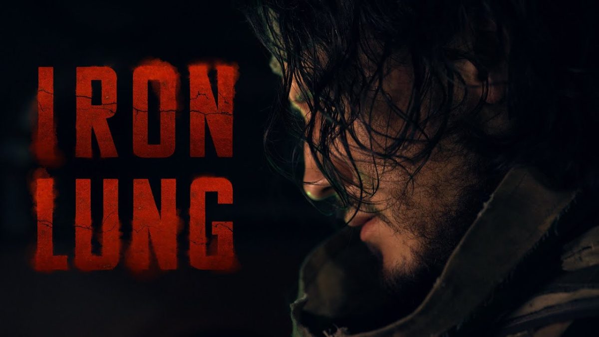 Thumbnail of “Iron Lung: Final Trailer” on YouTube. Photo featuring Mark “Markiplier” Fishbach on the right and the text “Iron Lung” on the left. 